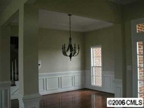 3104 East Lawyers Road Monroe, NC 28110 - Photo 5 of 7 a picture of a room with a window and wooden floor
