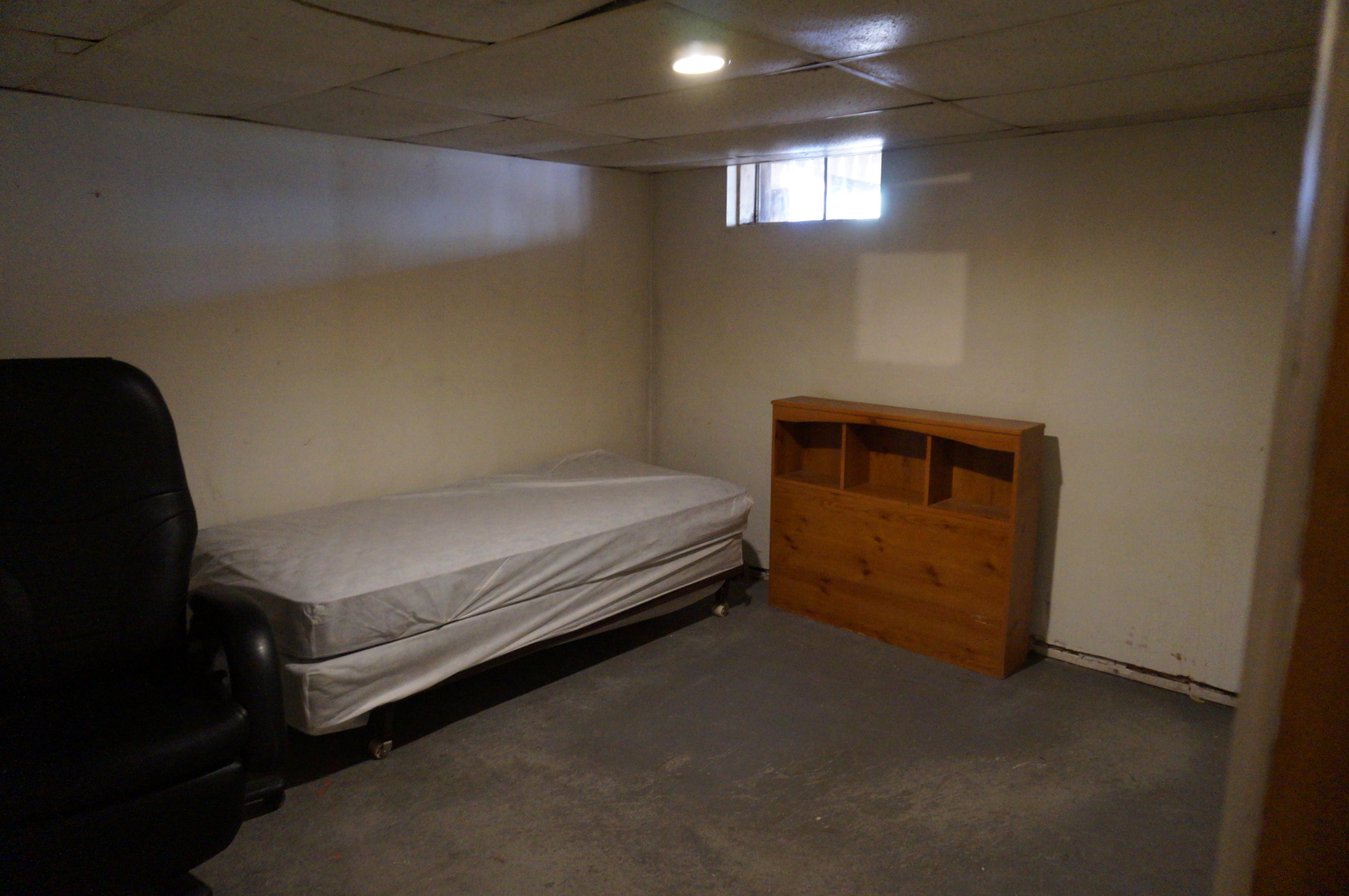 207 Hinckley Road Hyannis, MA 02601 - Photo 15 of 17 a bedroom with a bed and window