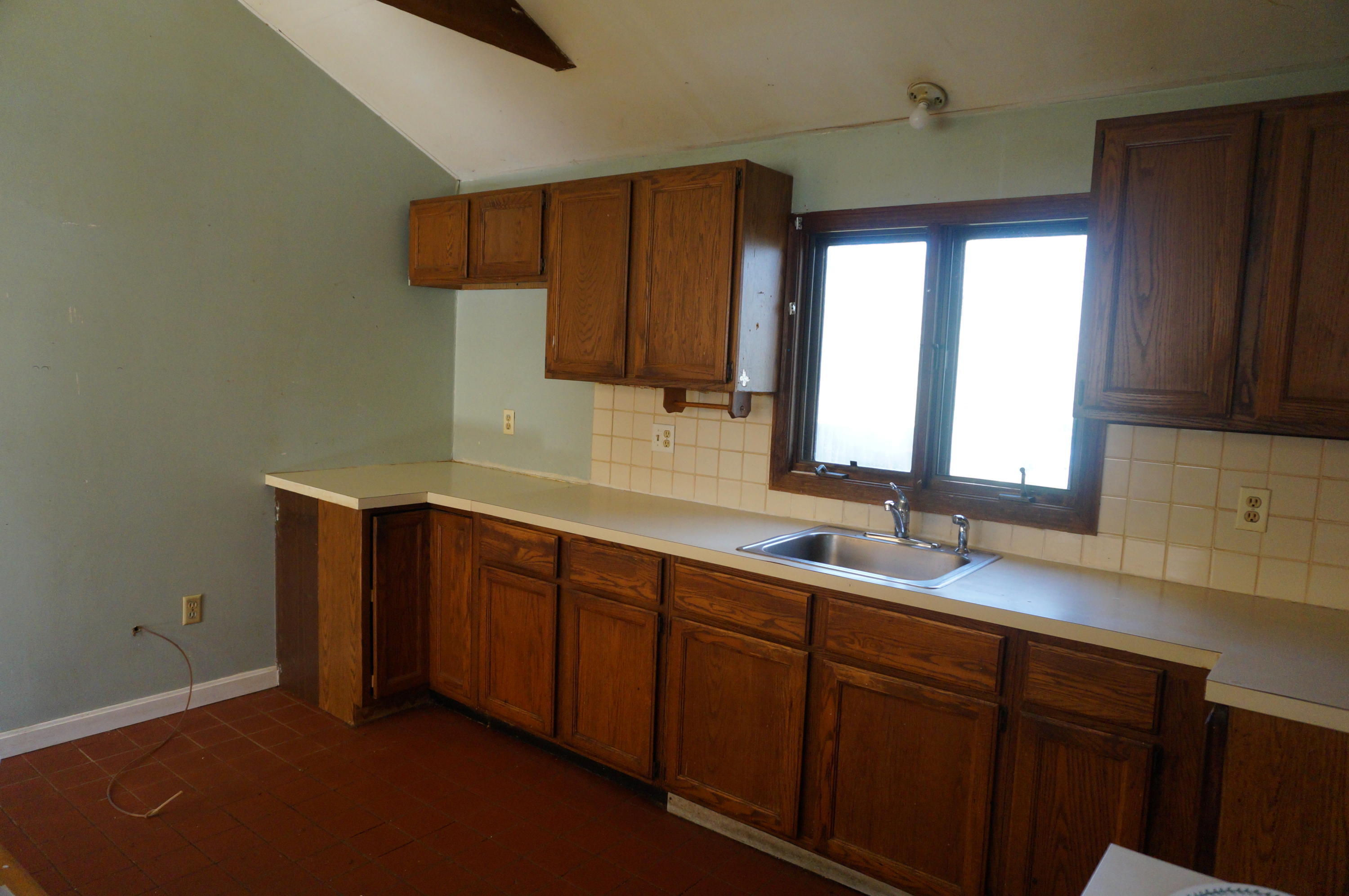 207 Hinckley Road Hyannis, MA 02601 - Photo 2 of 17 a kitchen with sink and cabinets