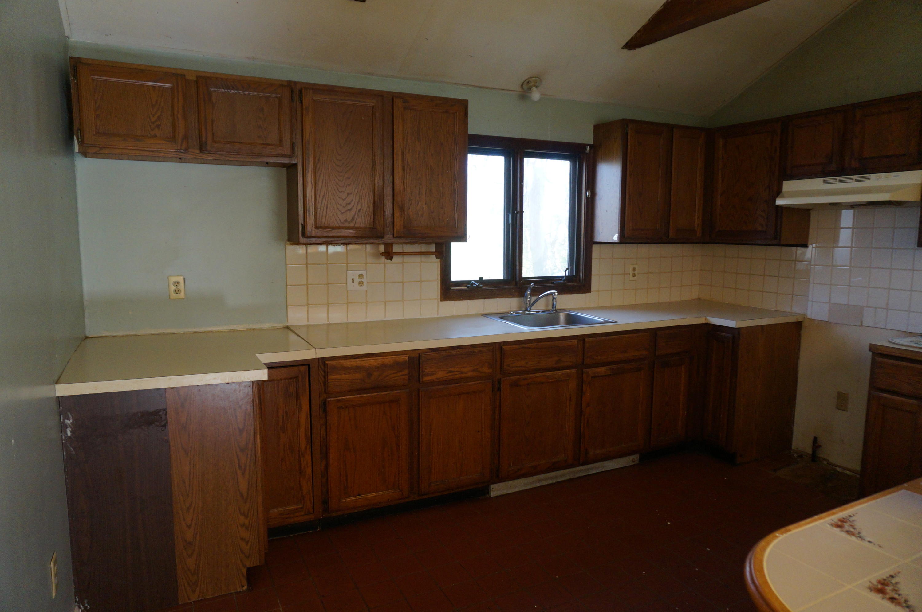 207 Hinckley Road Hyannis, MA 02601 - Photo 3 of 17 a kitchen with sink and cabinets