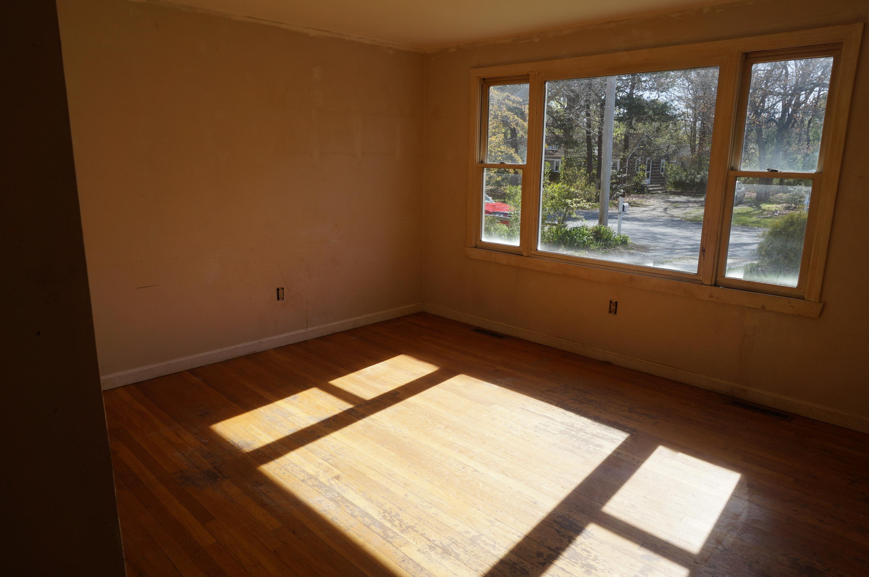 207 Hinckley Road Hyannis, MA 02601 - Photo 4 of 17 a view of an empty room and window