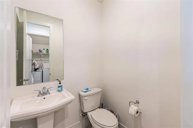 a view of entryway and gallery with wooden floor