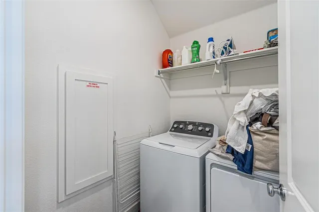 a bathroom with a sink mirror and toilet