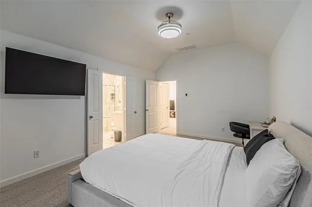 a bedroom with a bed and a chair