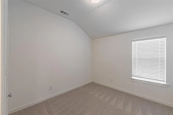a living room with furniture and a ceiling fan