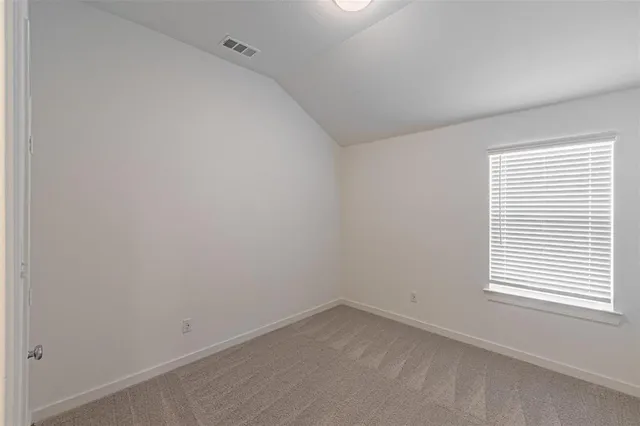 a living room with furniture and a ceiling fan