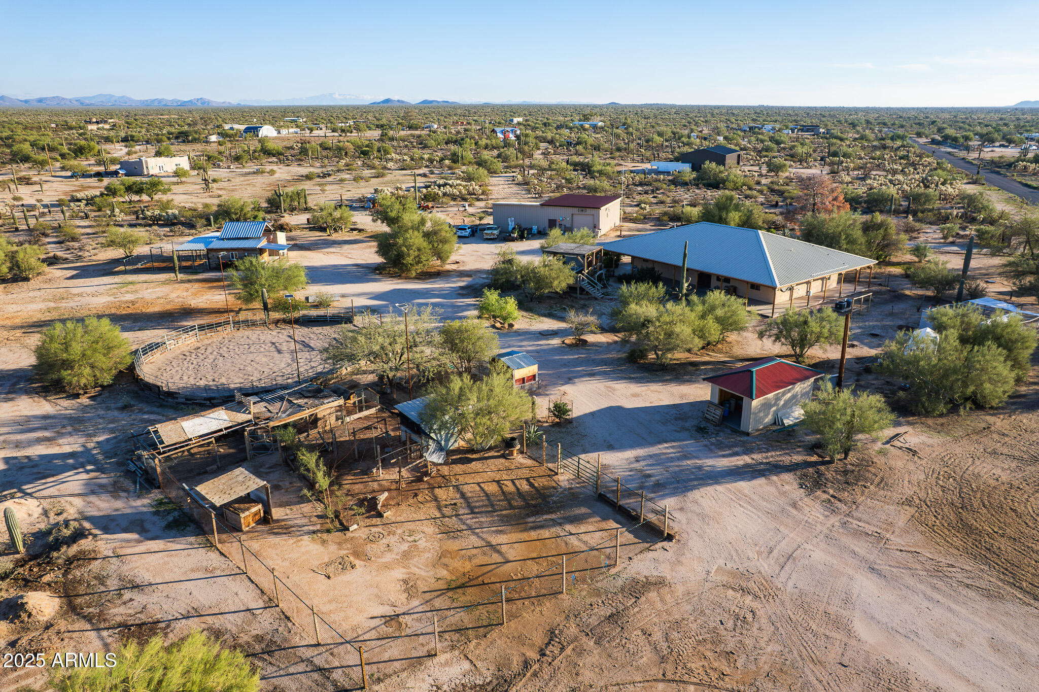 an aerial view of a houses with a swimming pool