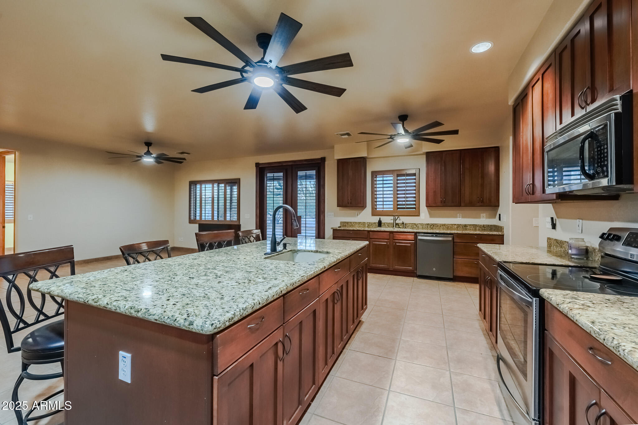 11003 North Hohokam Road Florence, AZ 85132 - Photo 14 of 90 a kitchen with stainless steel appliances granite countertop a sink stove and refrigerator