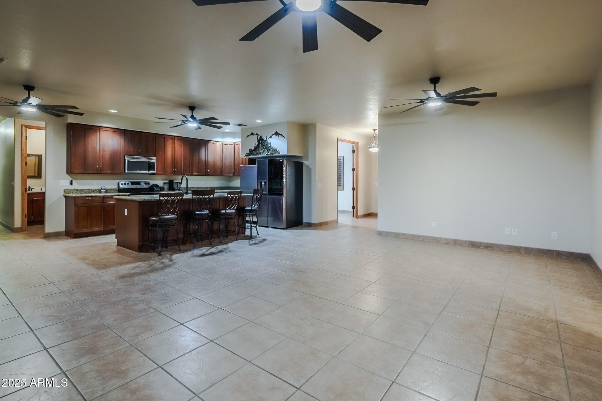 11003 North Hohokam Road Florence, AZ 85132 - Photo 15 of 90 an empty room with windows chandelier fan and windows