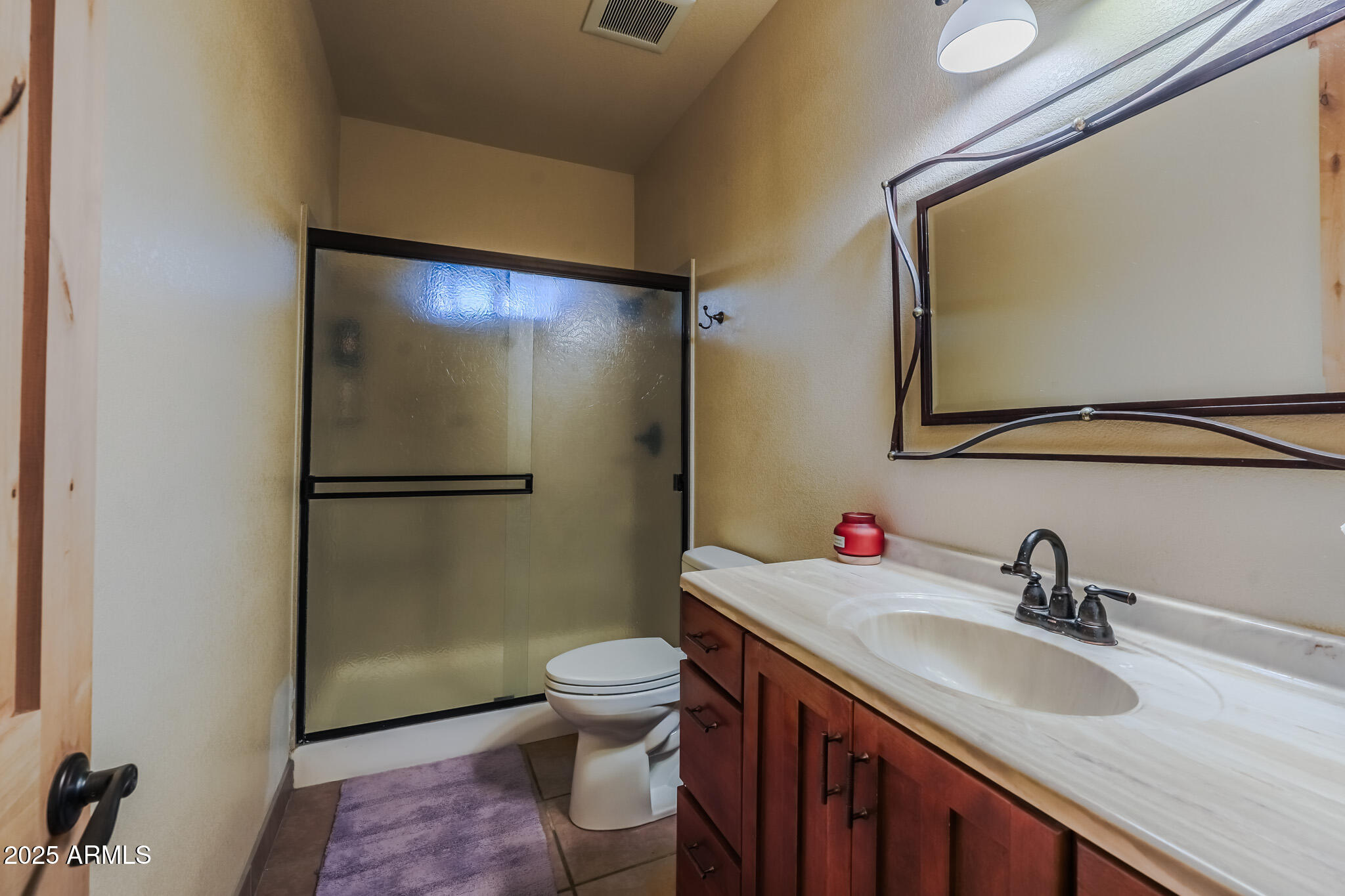 11003 North Hohokam Road Florence, AZ 85132 - Photo 17 of 90 a bathroom with a sink toilet and shower