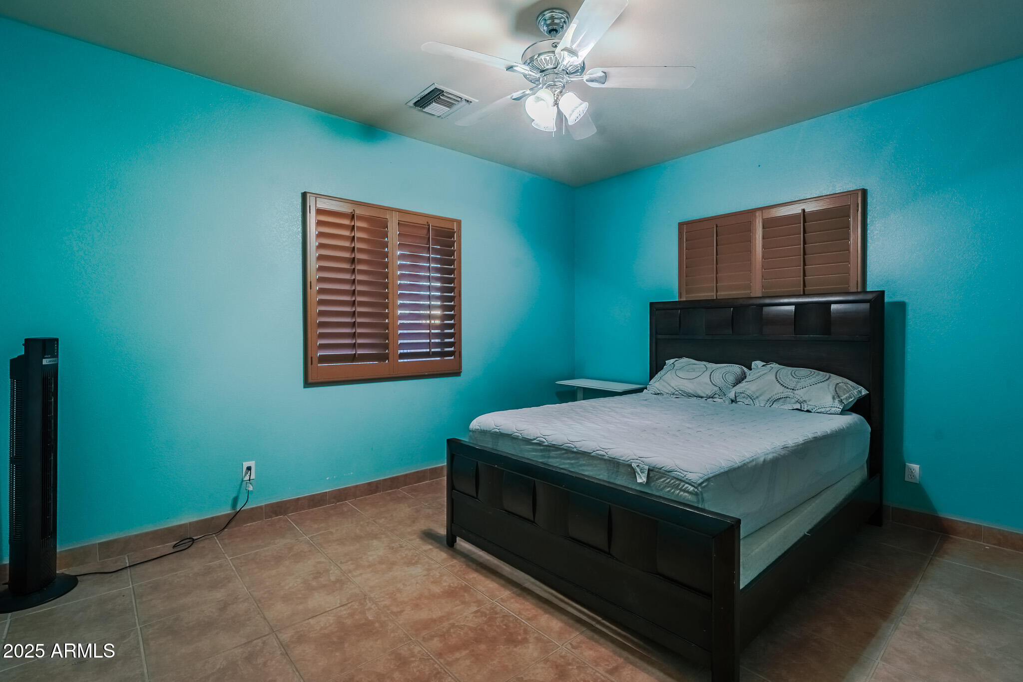 11003 North Hohokam Road Florence, AZ 85132 - Photo 19 of 90 a bedroom with a bed and a window