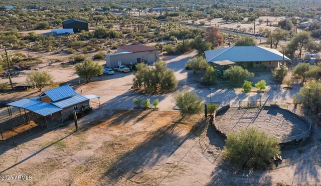 an aerial view of a houses with a yard