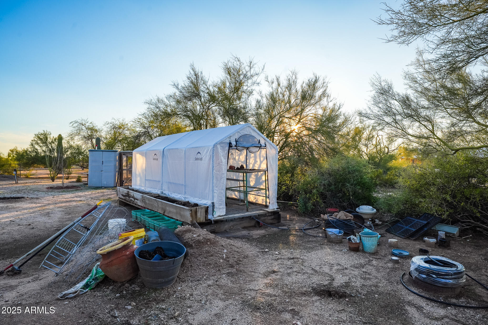 11003 North Hohokam Road Florence, AZ 85132 - Photo 55 of 90 a backyard of a house with barbeque oven and outdoor seating