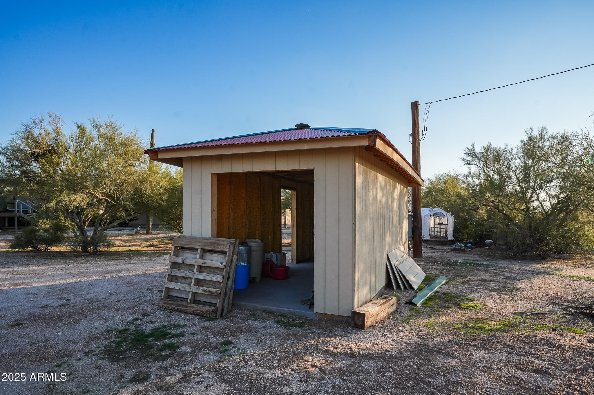 11003 North Hohokam Road Florence, AZ 85132 - Photo 56 of 90 a view of a house with a yard and wooden fence