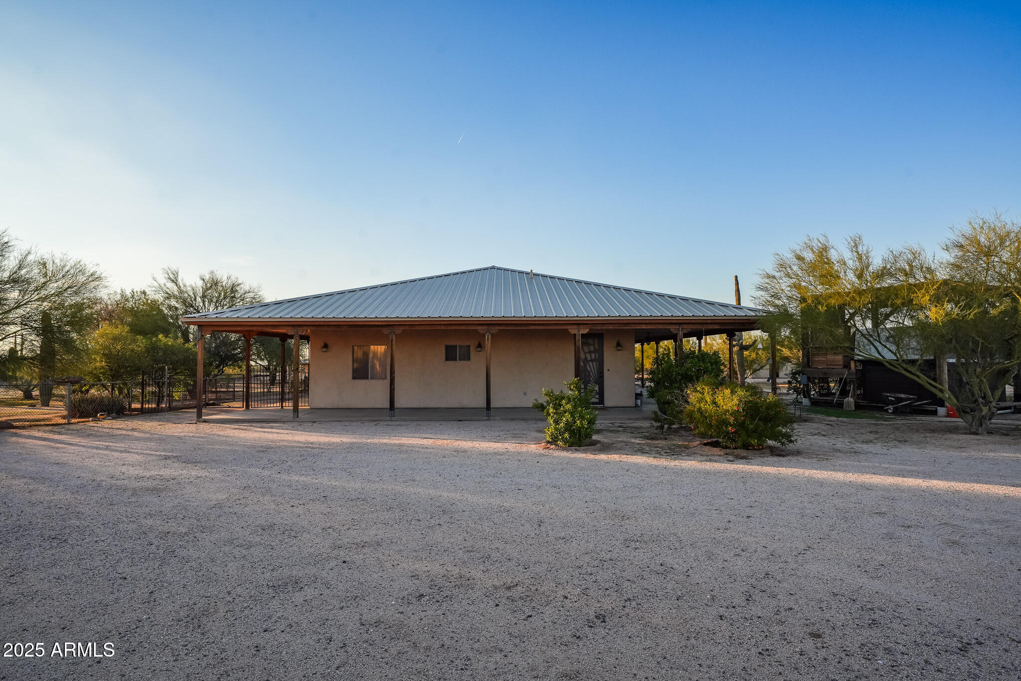 11003 North Hohokam Road Florence, AZ 85132 - Photo 77 of 90 a front view of a house with a yard and garage