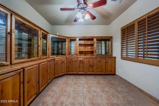a kitchen with granite countertop cabinets a sink and a counter top space