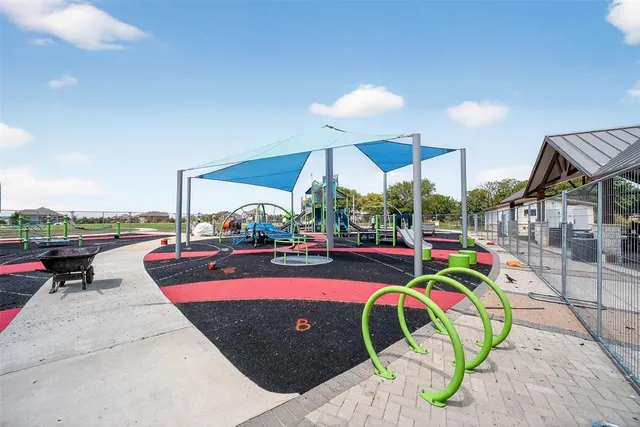 a view of a swimming pool with a lounge chairs and couches
