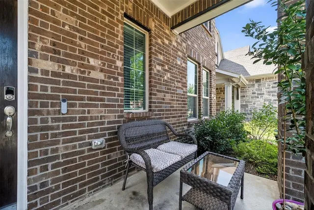 a living room with furniture a rug and a window