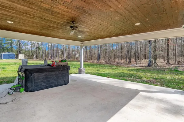 a living room with a couch and a backyard