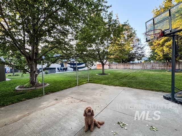 808 O'Leary Way Twin Falls, ID 83301 - Photo 37 of 37 Expansive backyard featuring a large concrete patio, mature trees, and a manicured lawn