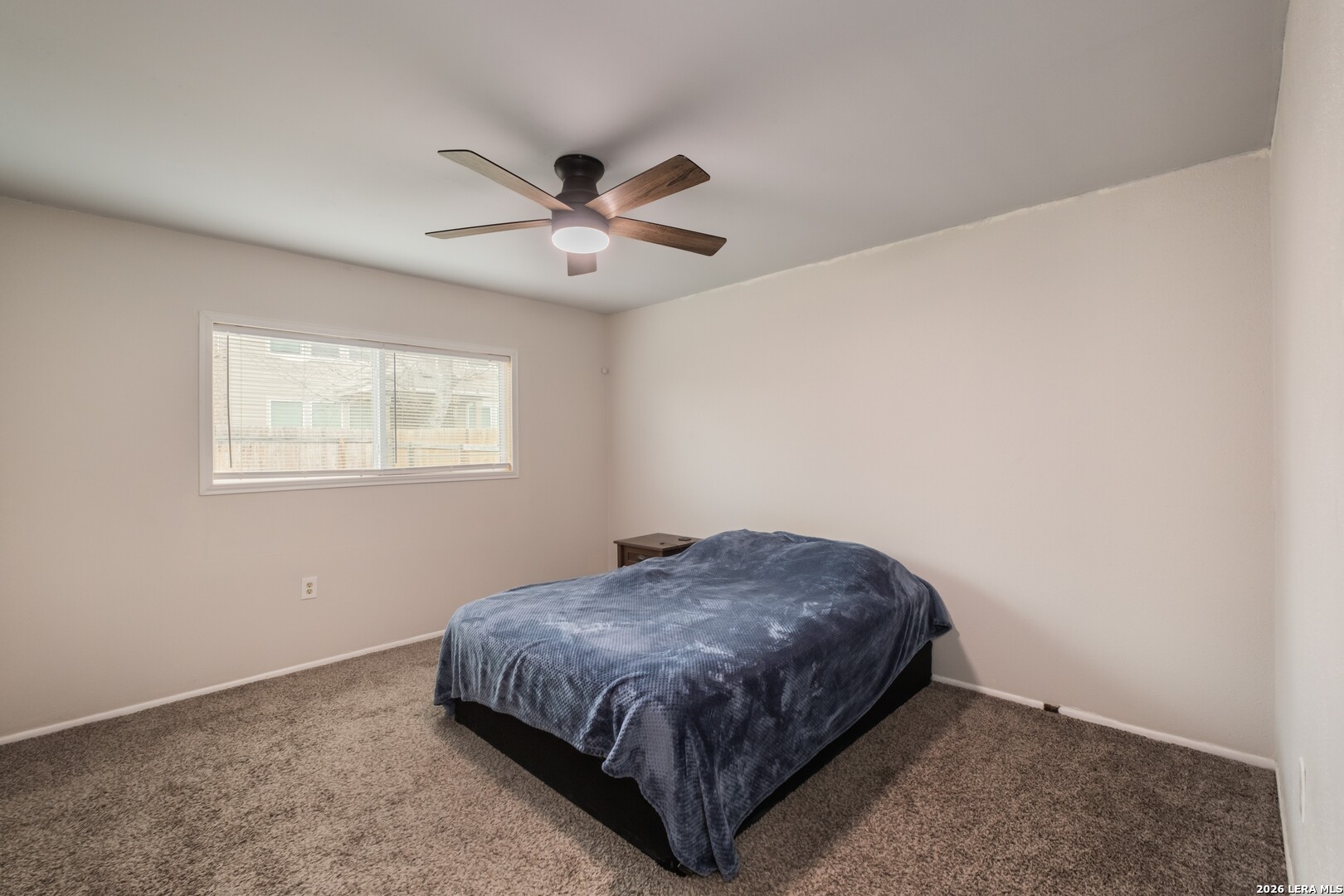 113 Friendswood Path Universal City, TX 78148 - Photo 11 of 30 a spacious bedroom with a bed and a window