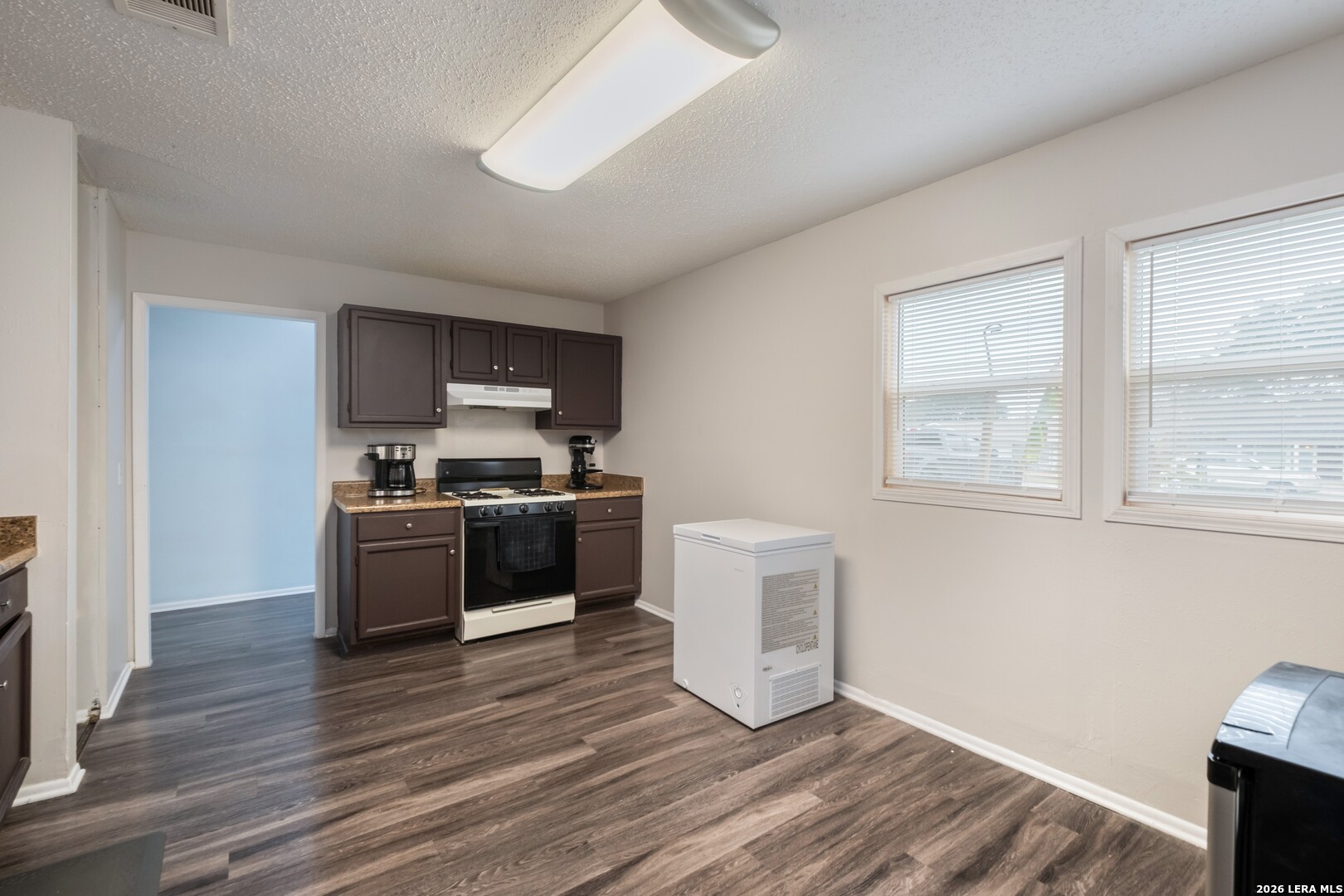 113 Friendswood Path Universal City, TX 78148 - Photo 6 of 30 a kitchen with stainless steel appliances a refrigerator and a stove top oven