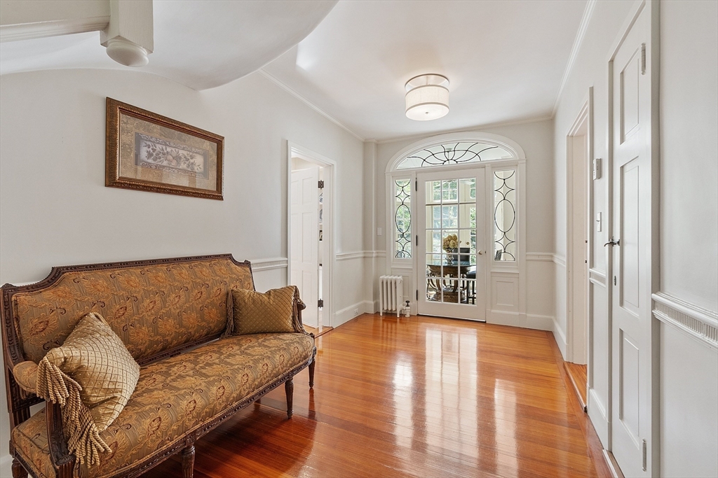 251 A Old Billerica Road Bedford, MA 01730 - Photo 14 of 36 a living room with furniture and a chandelier