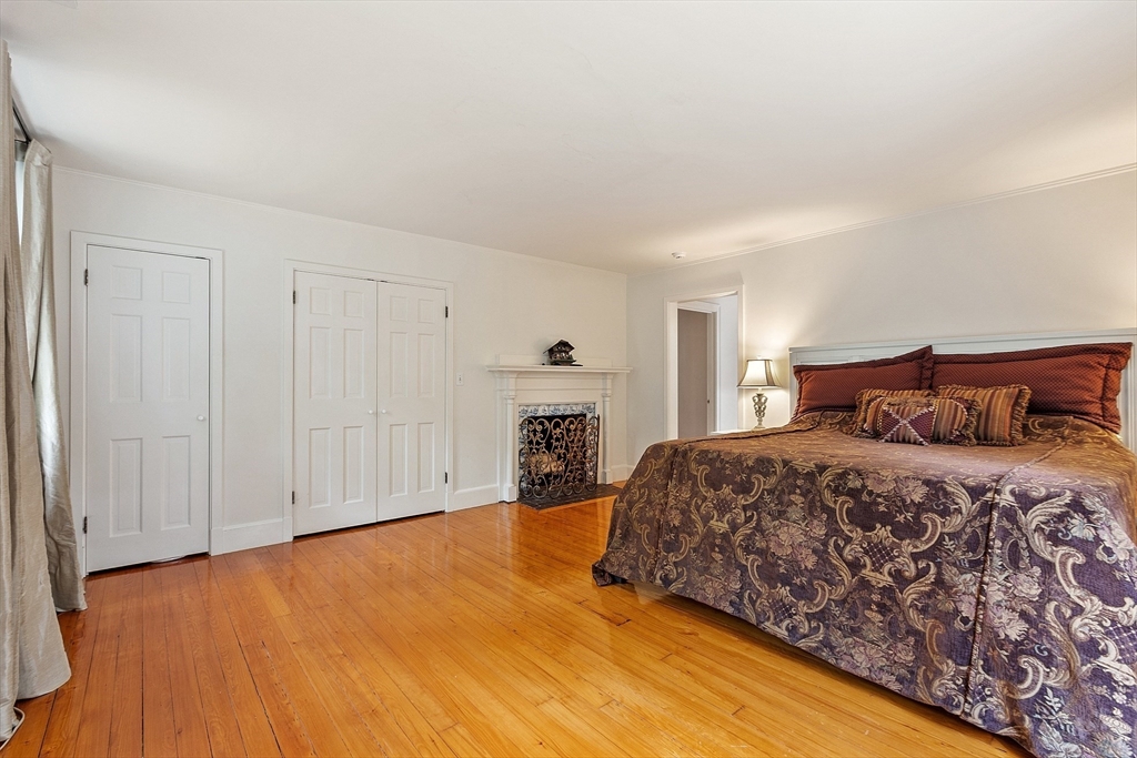 251 A Old Billerica Road Bedford, MA 01730 - Photo 16 of 36 a spacious bedroom with a bed and a window