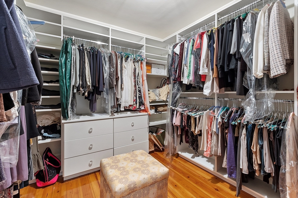251 A Old Billerica Road Bedford, MA 01730 - Photo 17 of 36 a view of walk in closet with clothes and shoes