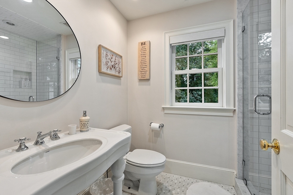 251 A Old Billerica Road Bedford, MA 01730 - Photo 26 of 36 a bathroom with a toilet sink and mirror