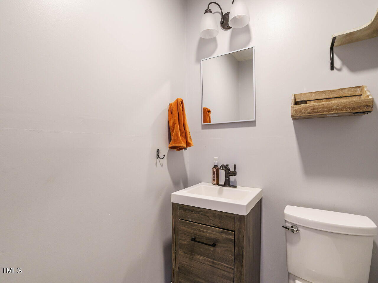1411 Vandora Springs Road Garner, NC 27529 - Photo 17 of 29 powder room connected to primary bedroom