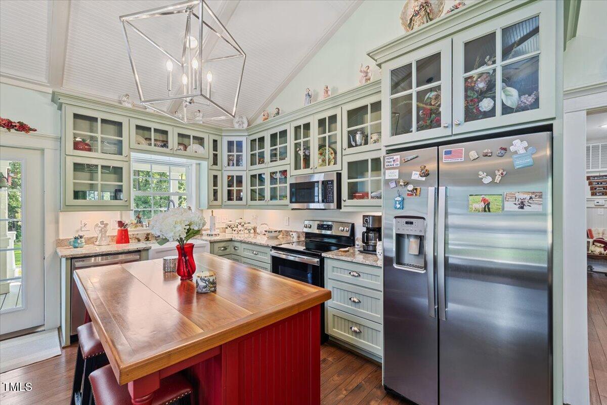 468 Loftis Loop Roxboro, NC 27574 - Photo 14 of 35 a kitchen with a refrigerator stove and sink