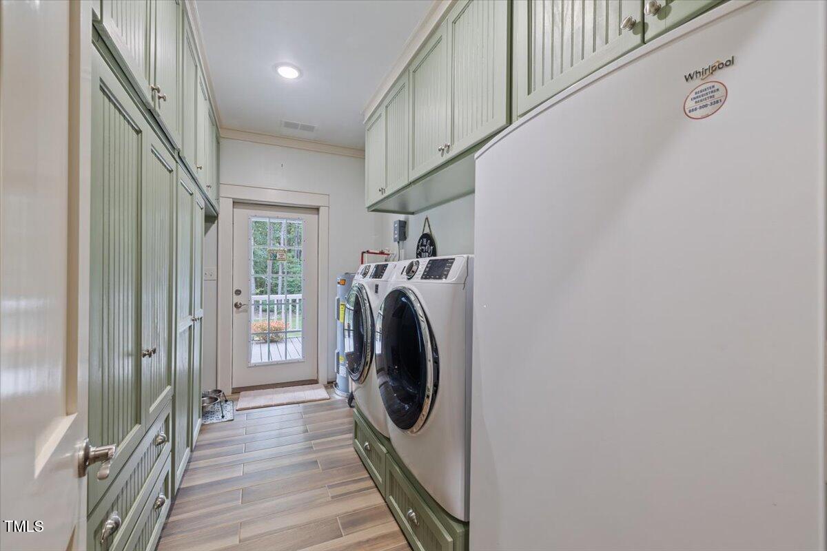 468 Loftis Loop Roxboro, NC 27574 - Photo 18 of 35 a view of a storage and utility room with a washer and dryer