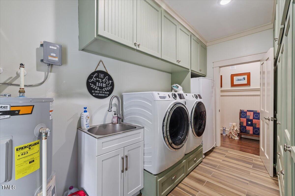 468 Loftis Loop Roxboro, NC 27574 - Photo 19 of 35 a utility room with dryer washer and a view of kitchen