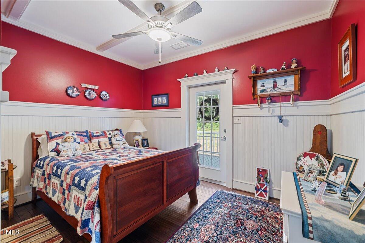 468 Loftis Loop Roxboro, NC 27574 - Photo 22 of 35 a bedroom with a bed and a chandelier