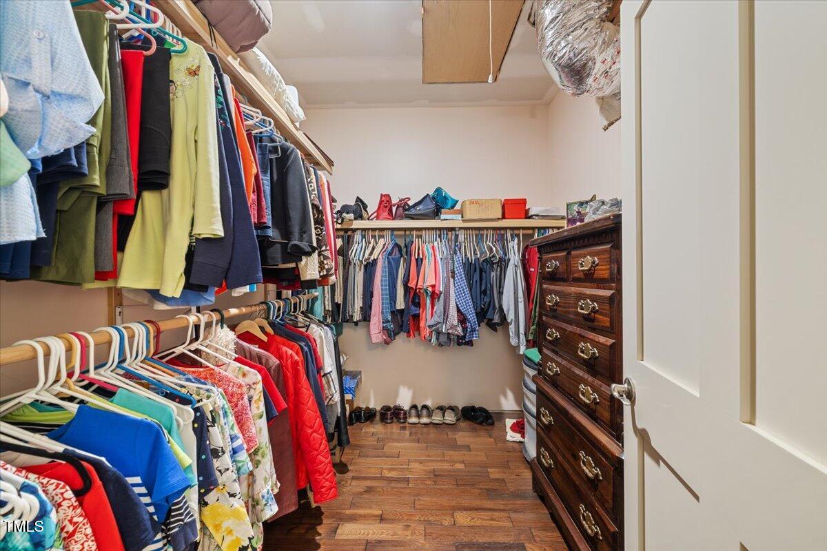 468 Loftis Loop Roxboro, NC 27574 - Photo 26 of 35 a view of walk in closet with clothes and shoes