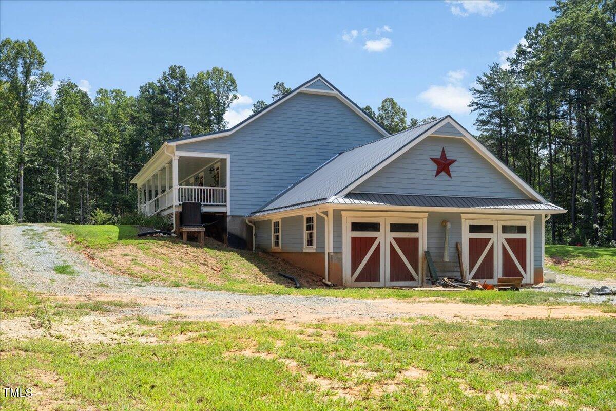 468 Loftis Loop Roxboro, NC 27574 - Photo 31 of 35 a front view of a house with garden