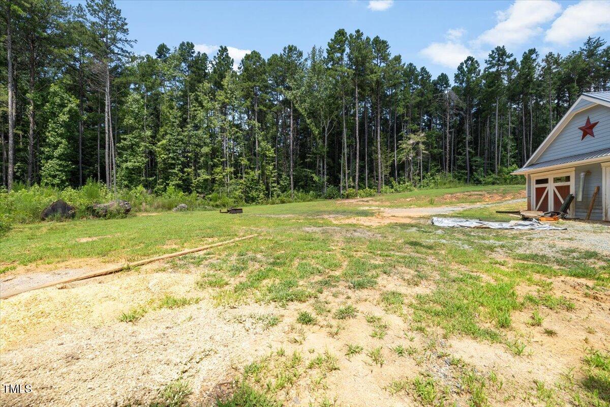 468 Loftis Loop Roxboro, NC 27574 - Photo 32 of 35 a swimming pool with trees in the background