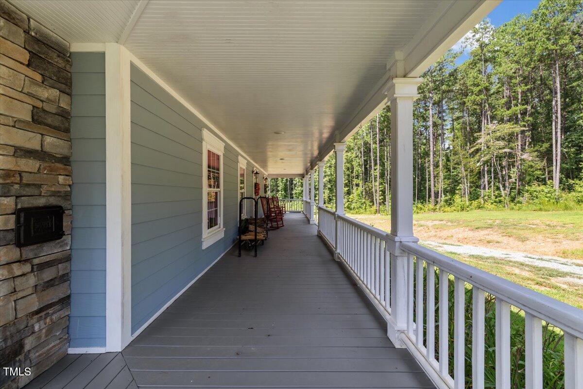 468 Loftis Loop Roxboro, NC 27574 - Photo 6 of 35 a view of hallway with wooden floor and stairs