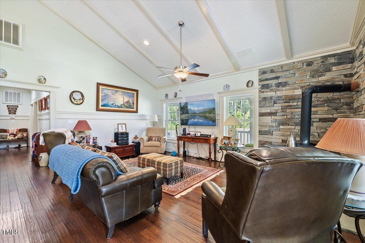 468 Loftis Loop Roxboro, NC 27574 - Photo 8 of 35 a living room with furniture a flat screen tv and a large window