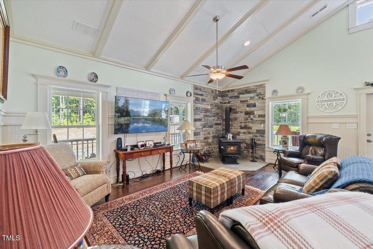 468 Loftis Loop Roxboro, NC 27574 - Photo 9 of 35 a living room with fireplace furniture and a flat screen tv