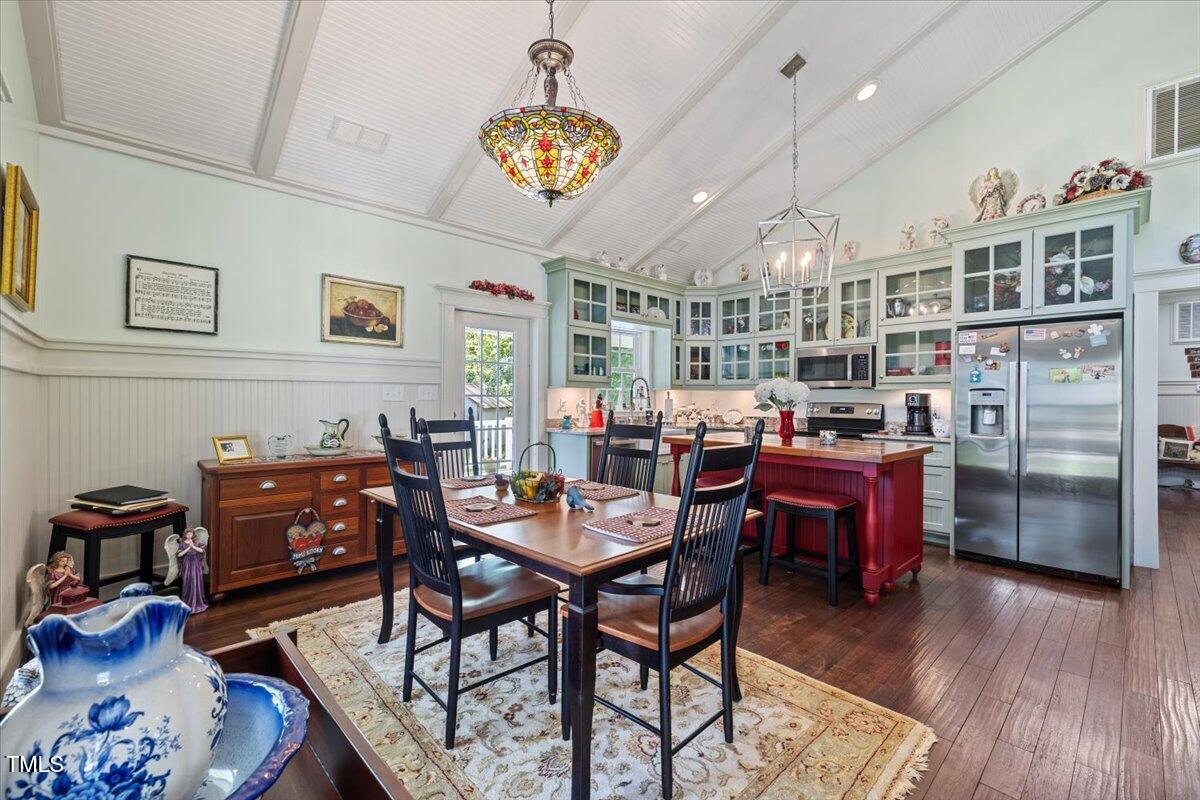 468 Loftis Loop Roxboro, NC 27574 - Photo 10 of 35 a view of a dining room with furniture and wooden floor