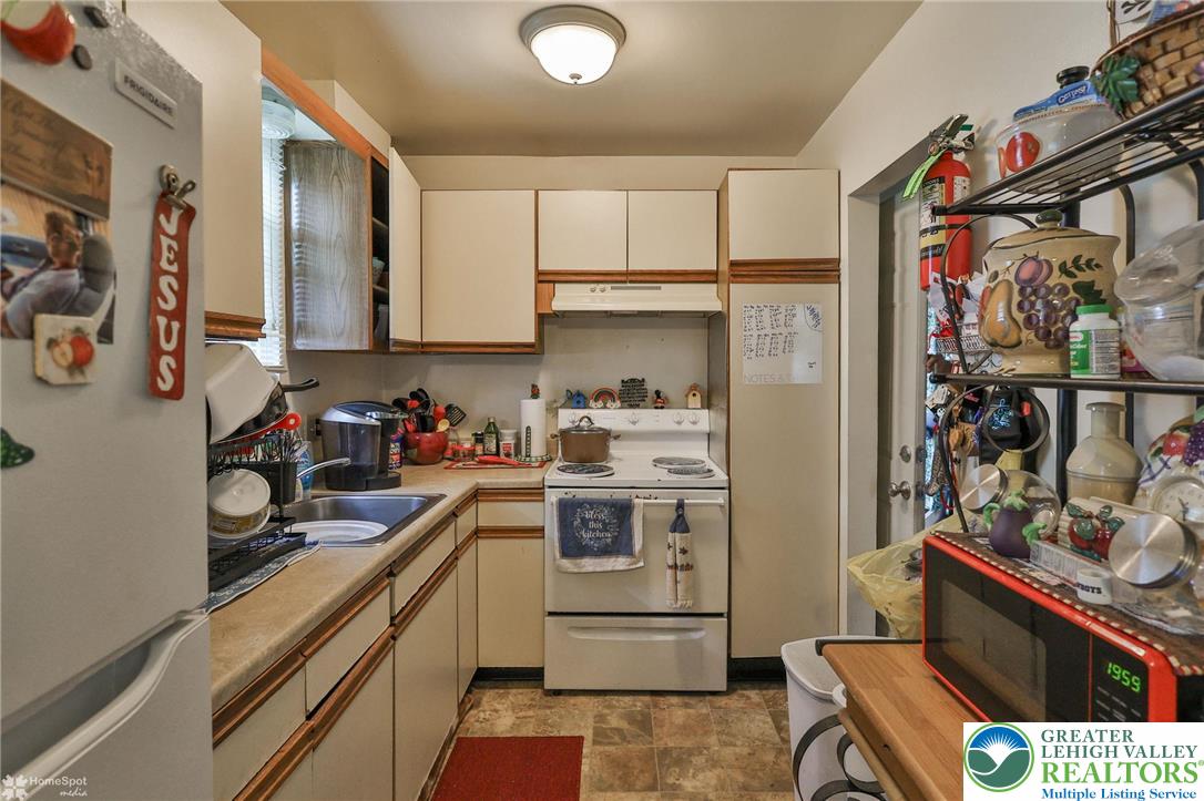 802 West Berwick Street Easton, PA 18042 - Photo 20 of 54 a kitchen with stainless steel appliances a sink stove and refrigerator