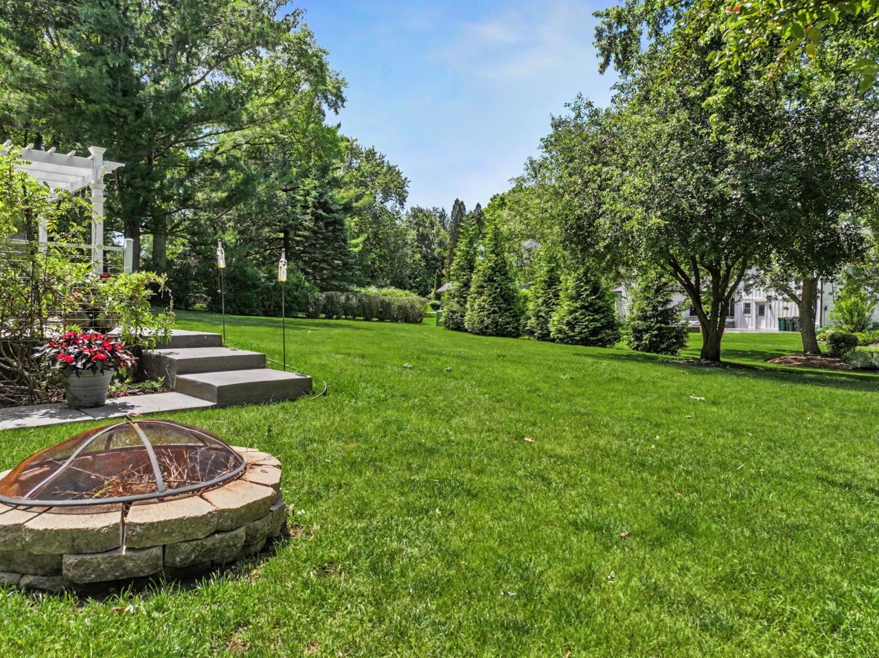 328 Windsor Lane Inverness, IL 60010 - Photo 29 of 33 a view of a backyard with table and chairs potted plants and large tree
