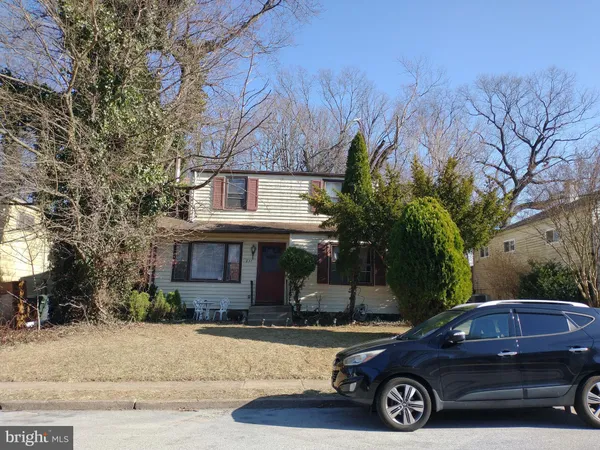 a view of a car parked front of a house