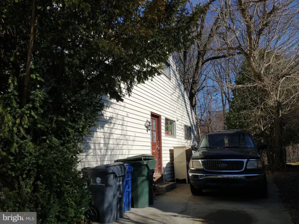 a view of a barbeque grill with a small yard
