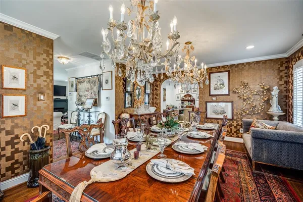 a dining room with furniture a rug and wooden floor