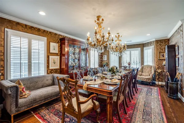 a living room with fireplace furniture and a chandelier