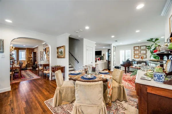 a living room with lots of furniture and view of kitchen