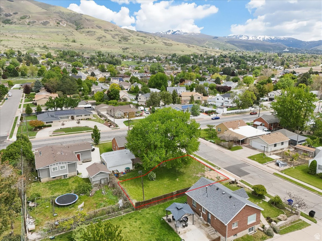 385 East Randall Way South, Unit 2 Centerville, UT 84014 - Photo 2 of 21 Aerial view of residential area featuring property boundaries highlighted and a mountainous background